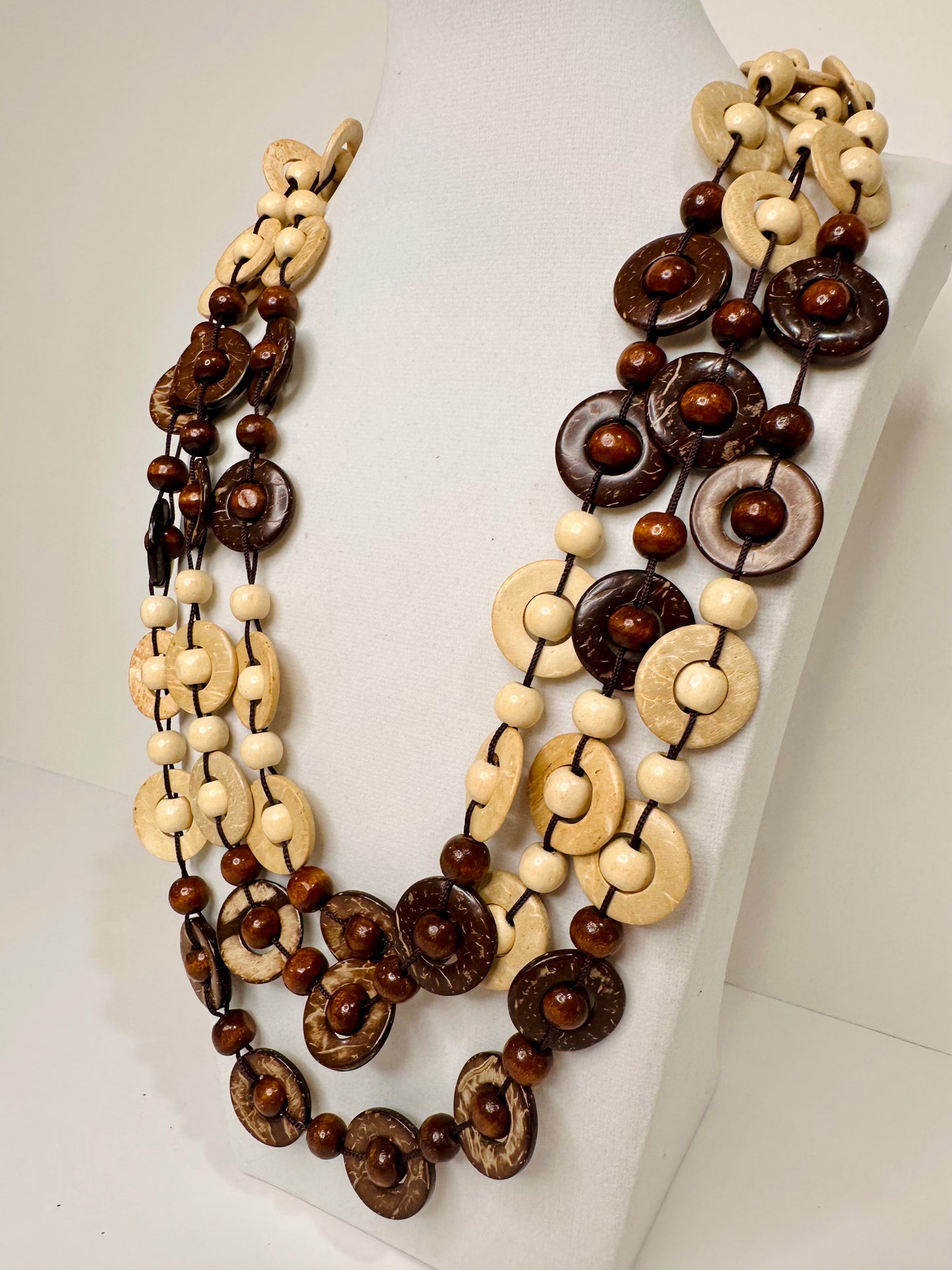 Brown coconut shell and açaí seed artisan necklace detail