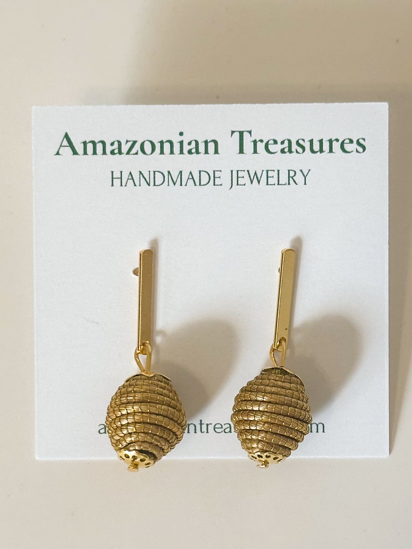 Golden grass earrings handcrafted with capim dourado by quilombola artisans