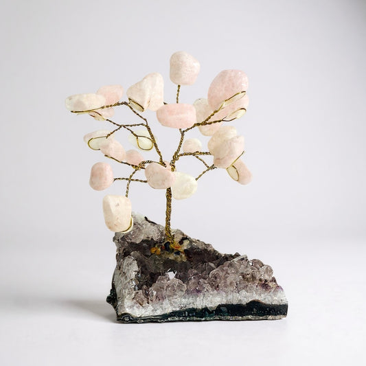 Handcrafted gemstone bonsai tree mounted on natural amethyst crystal base with wired branches and polished gemstone chips. Rose Quartz Tree