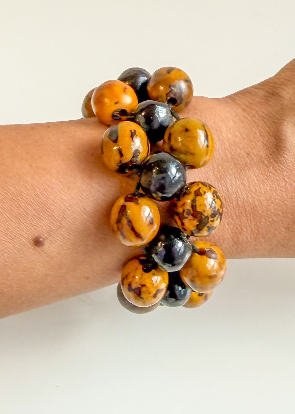 Natural Soap Seed and Caranã statement bracelet handmade by Brazilian artisans