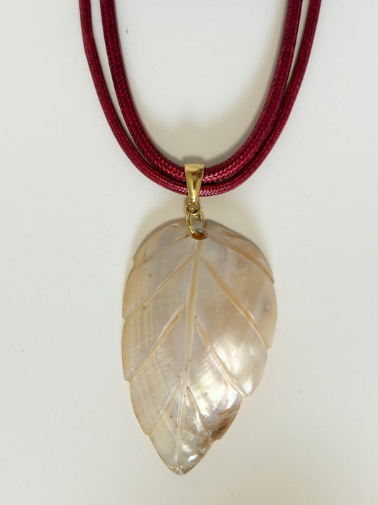 Natural mother of pearl leaf necklace with layered cord.
