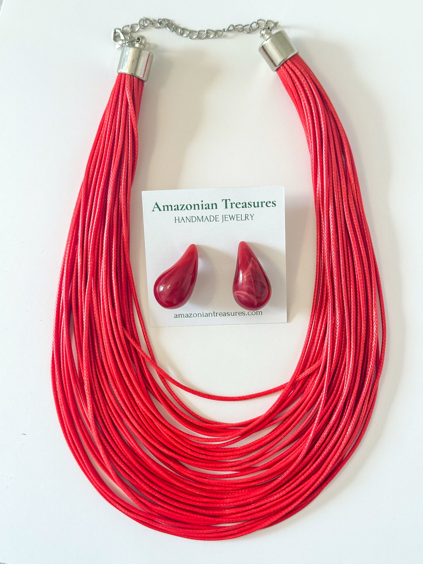Red layered cotton necklace with resin earrings.