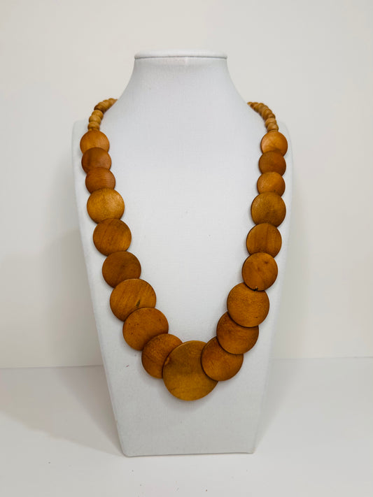 Sustainable reclaimed wood necklace with warm-toned wooden beads, handmade in Brazil
