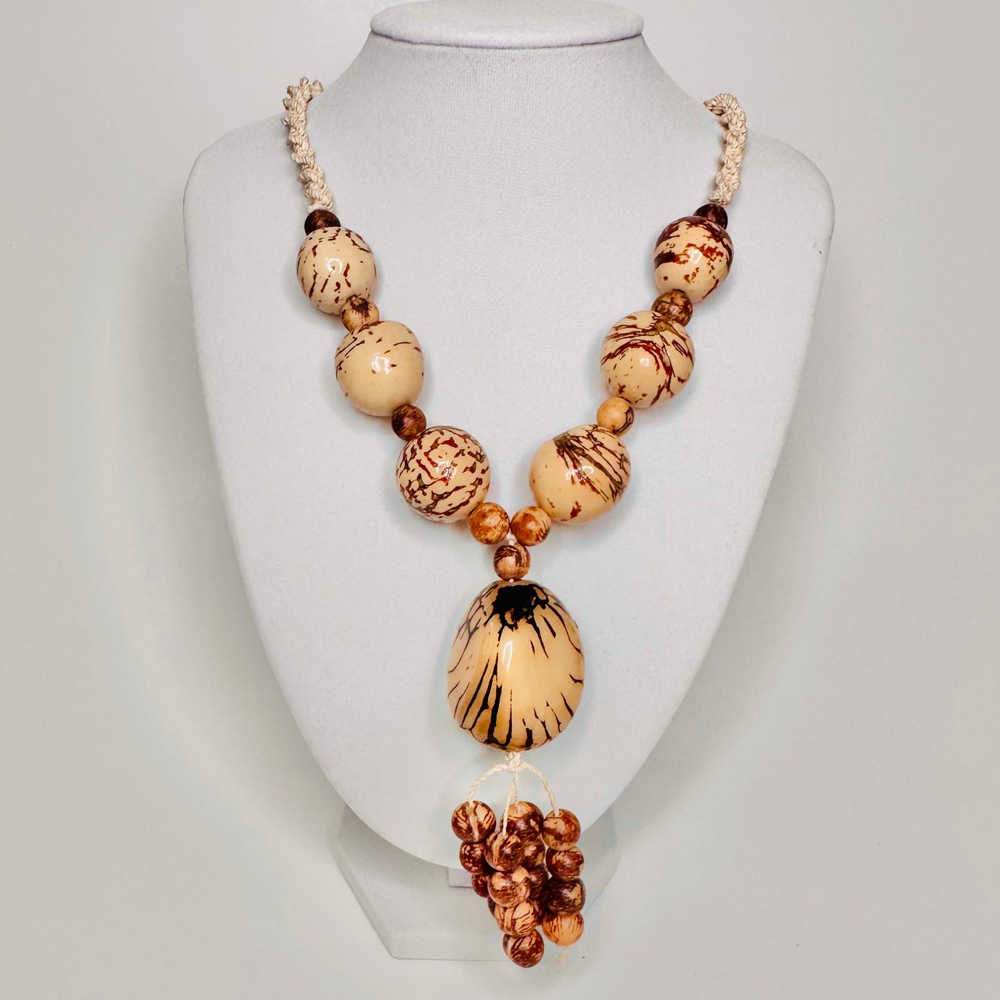 Handcrafted bio necklace jewelry made of tucum fiber, delicate jarina, and açaí seeds.