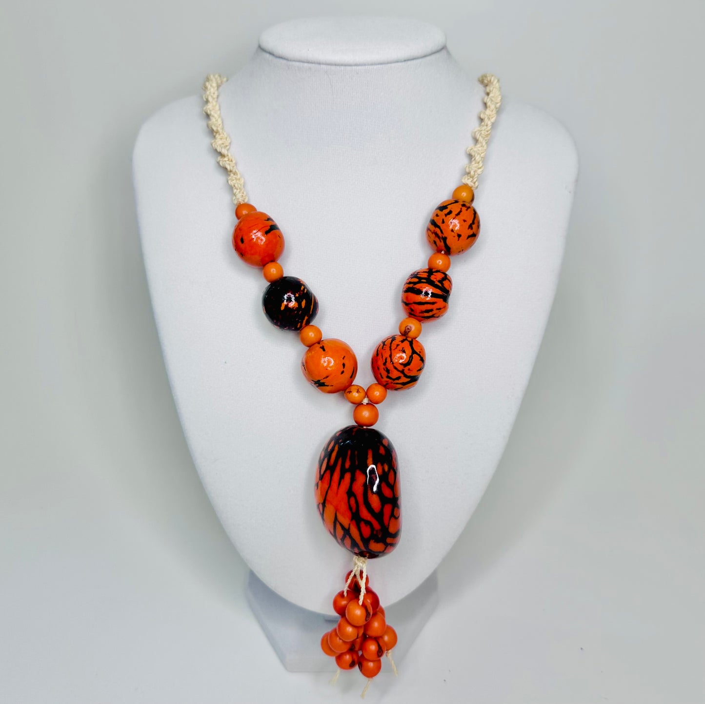 Handcrafted bio necklace jewelry made of tucum fiber, delicate jarina, and açaí seeds.