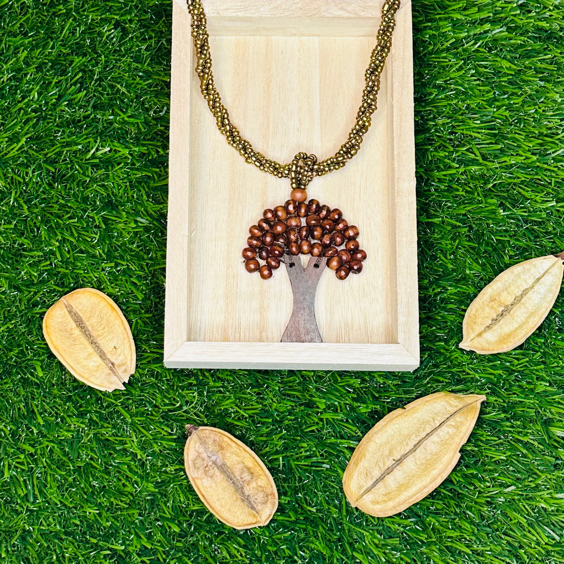 Eco handcrafted necklace made of colorful miçanga beads and natural wood.