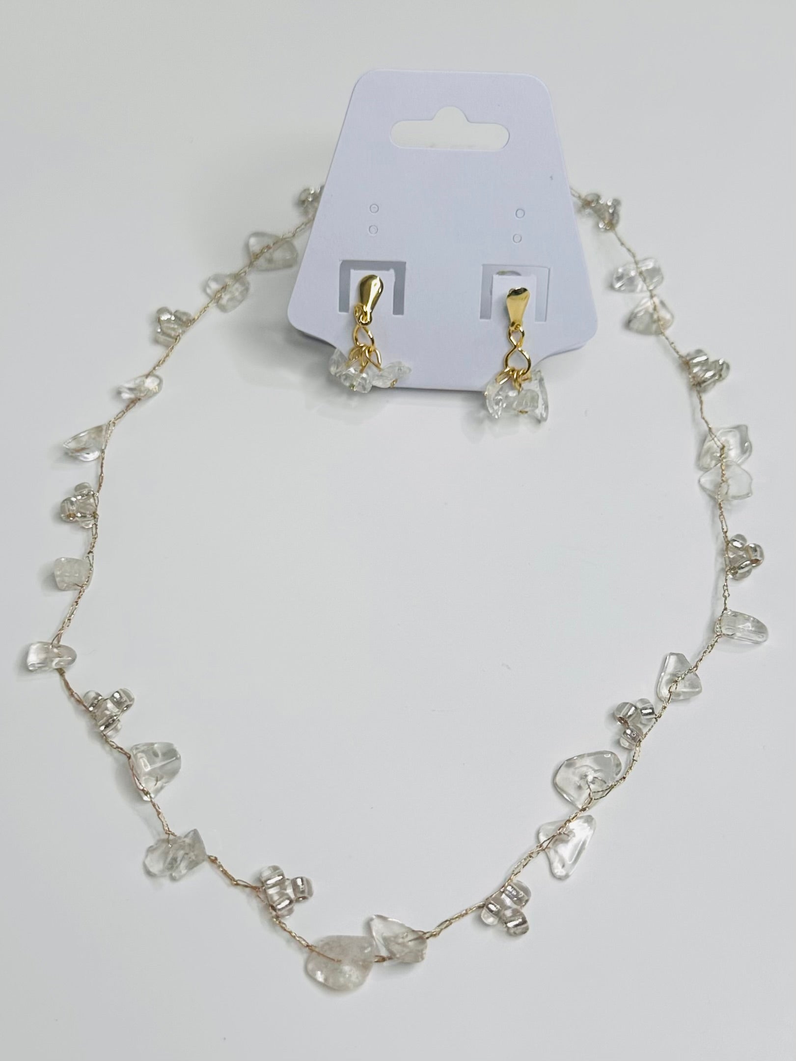 Clear Necklace and earrings set on gold thread