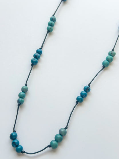 Blue dyed açaí seed necklace handcrafted in the Amazon.