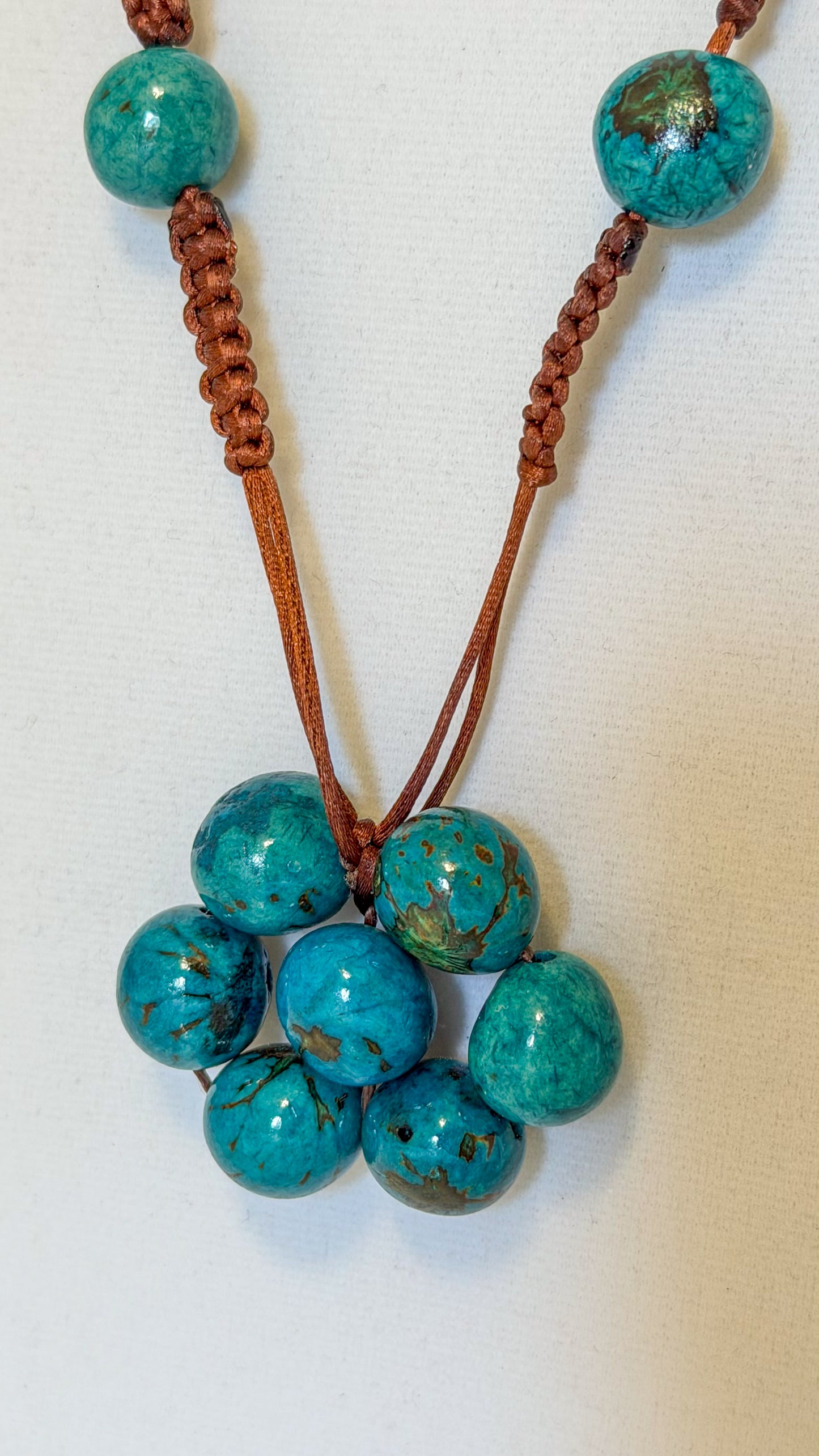 Brazilian artisan necklace with turquoise tinted Açaí seeds and Paxiúba