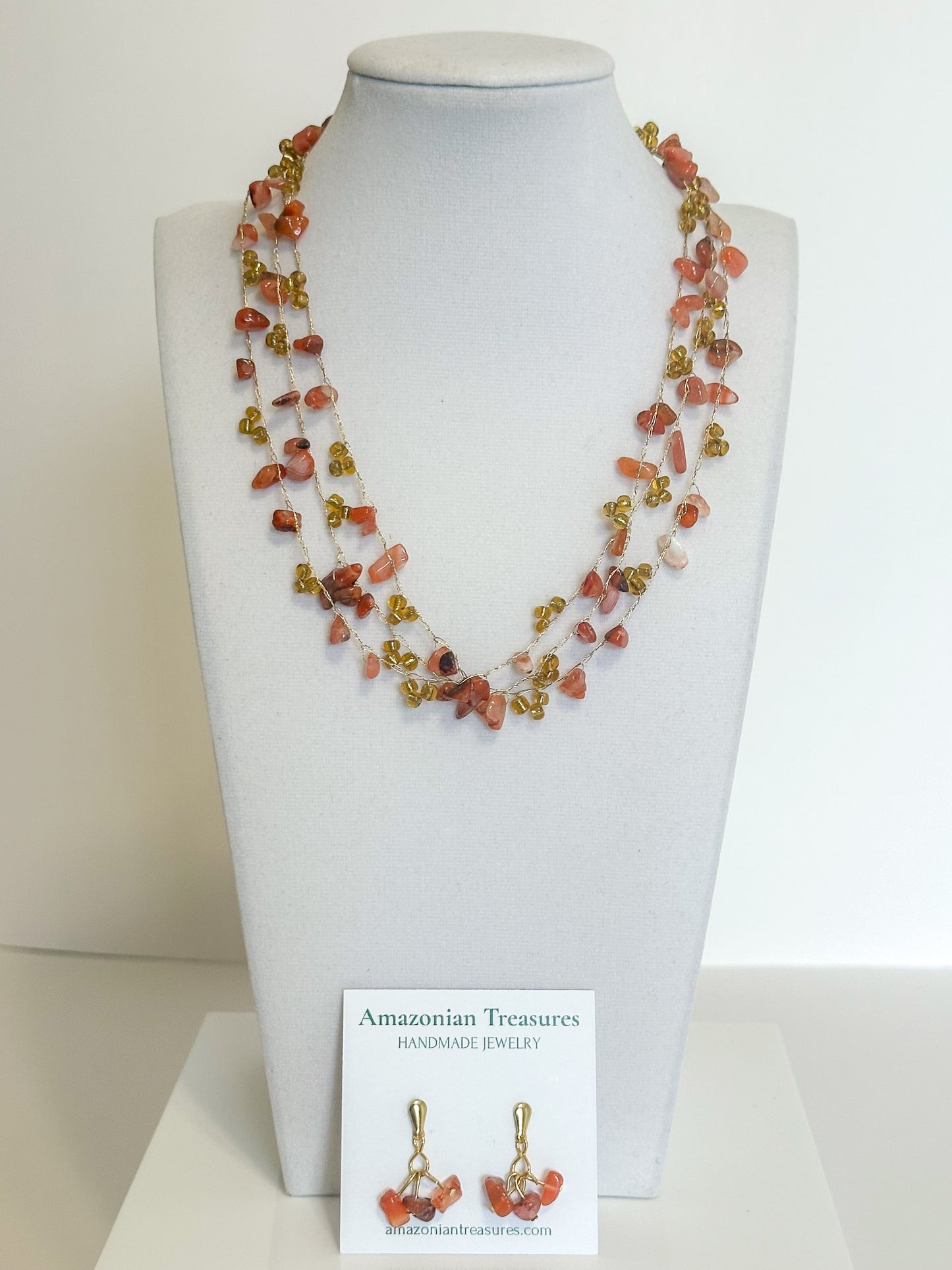Brazilian gemstone necklace with orange gemstone chips and glass beads.