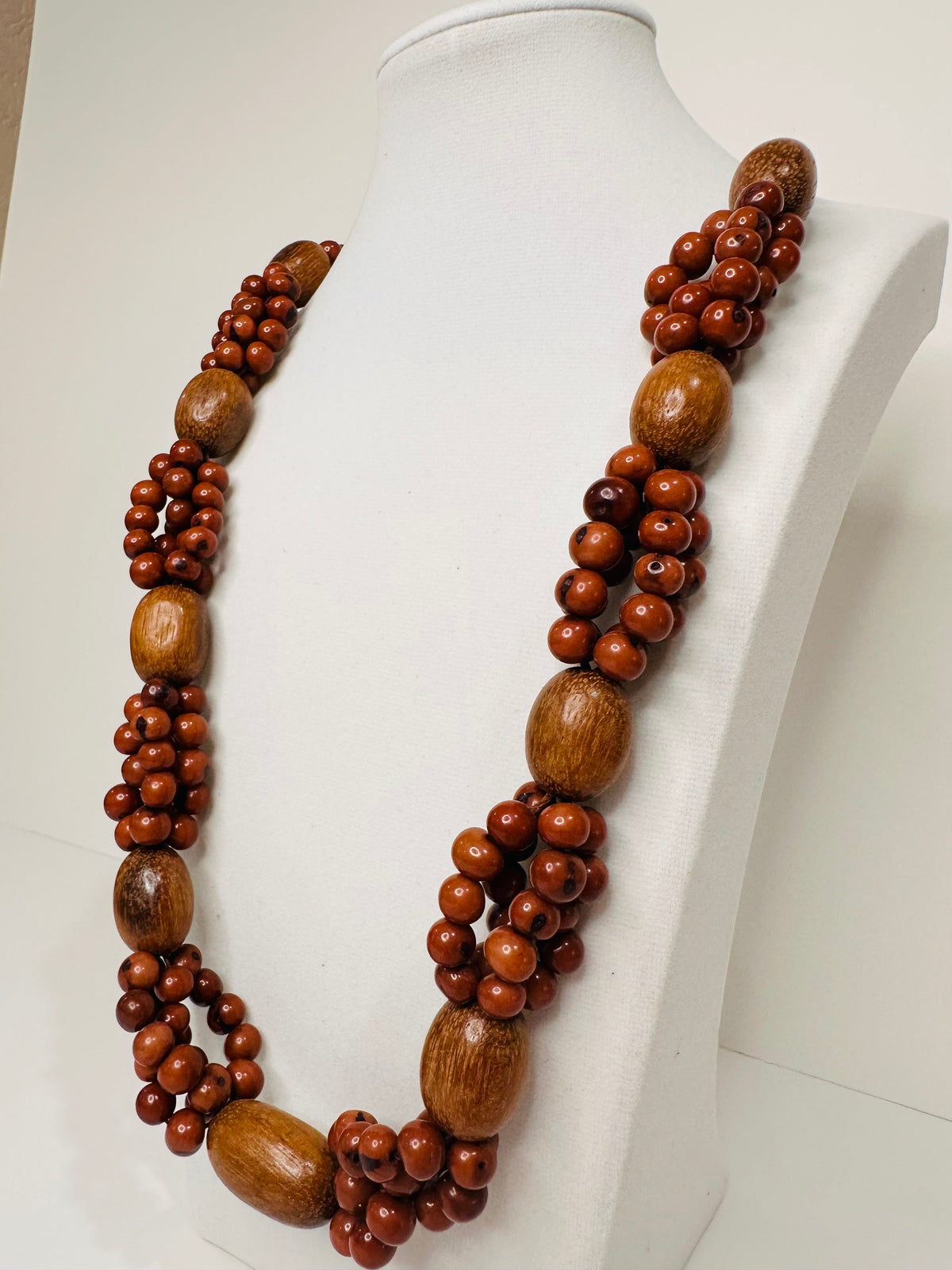 Brown açaí seed and wood artisan necklace close-up