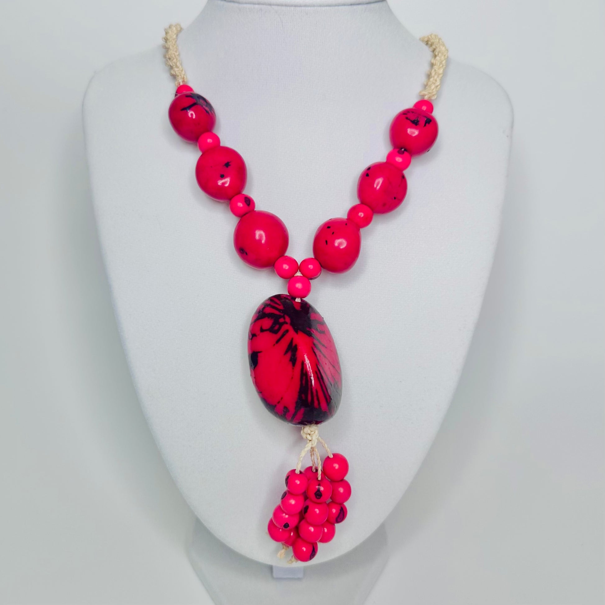 Handcrafted bio necklace jewelry made of tucum fiber, delicate jarina, and açaí seeds.