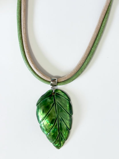 Carved mother of pearl leaf pendant from Amazon river shell details