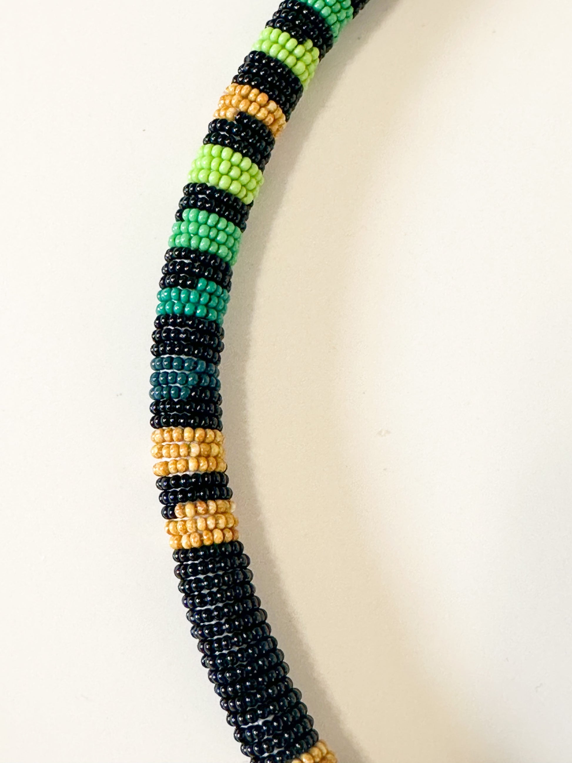 Close-up of Borari Indigenous glass bead necklace made with traditional miçangas beadwork