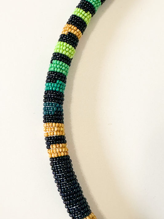 Close-up of Borari Indigenous glass bead necklace made with traditional miçangas beadwork