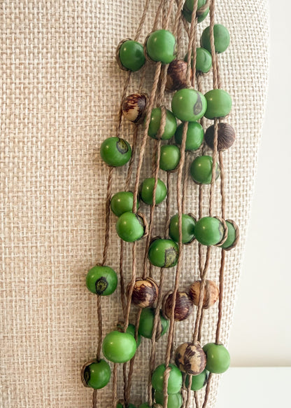 Close-up of multi-strand green Açaí seed necklace handcrafted in Brazil