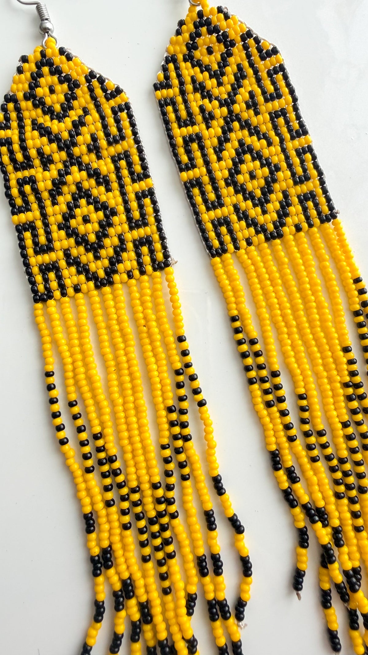 Close-up of recycled glass beadwork and fringe detail on 5.5 inch earrings