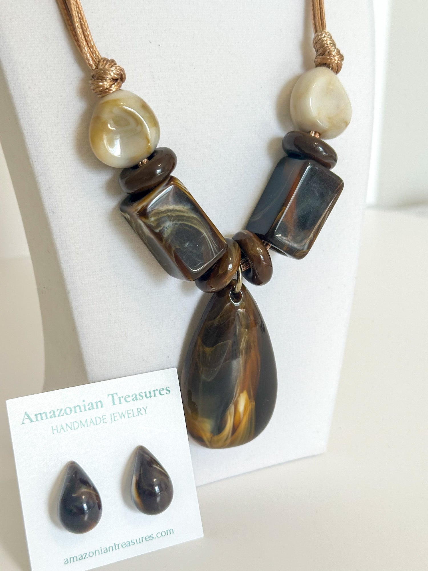 Close-up of resin drop pendant and geometric resin accents.