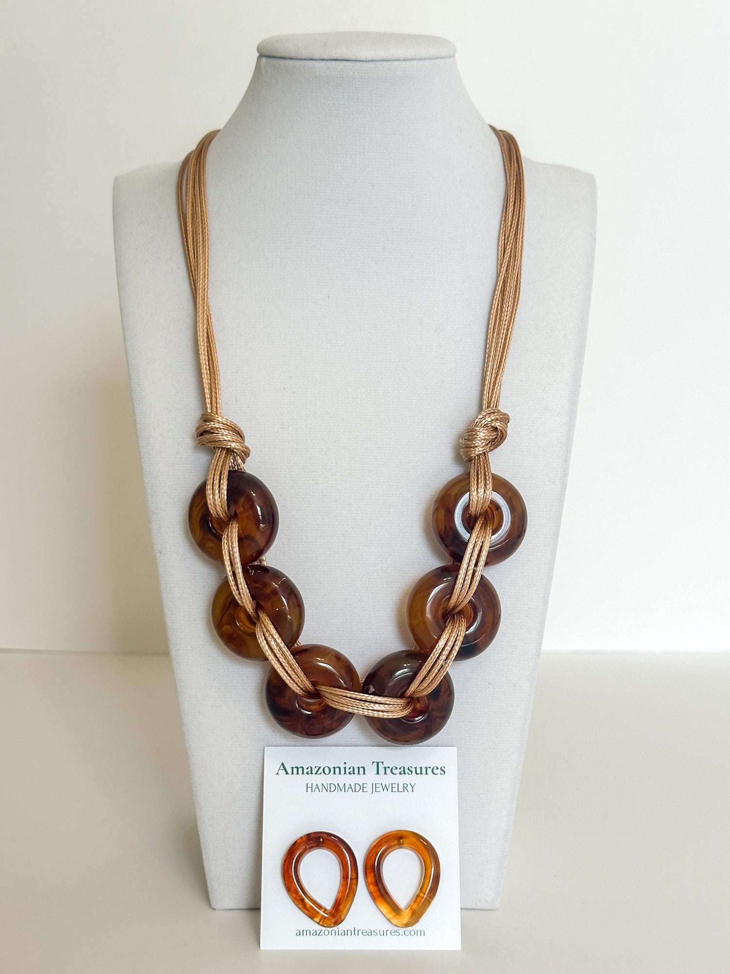 Cotton cord necklace with interlocking resin chain links and matching resin earrings designed by a Brazilian jewelry studio