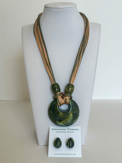 Cotton cord necklace with resin circle pendant and matching resin earrings designed by a Brazilian jewelry studio