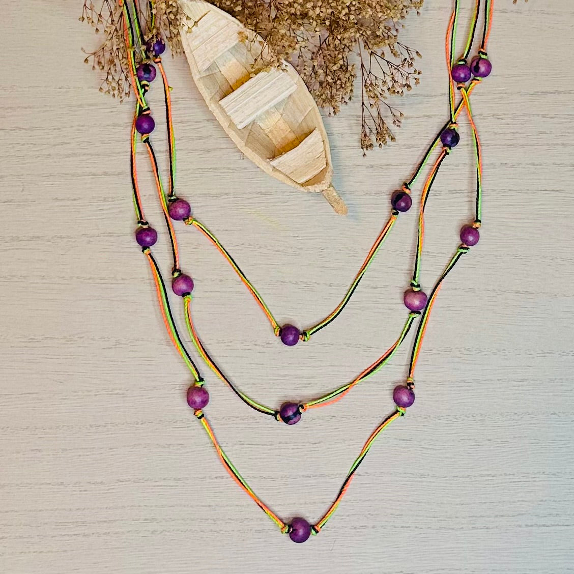 handmade bio jewelry. Necklace made of linen and açaí beads.