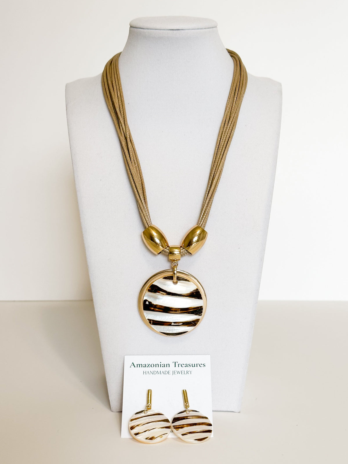 Freshwater mother of pearl necklace and earrings set handcrafted by an independent Brazilian artisan.