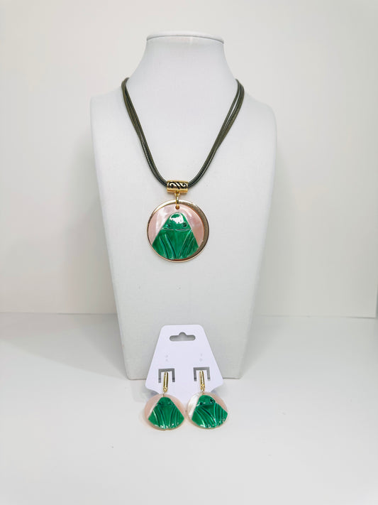 Necklace with green and mother of pearl pendant and matching earrings on a white background