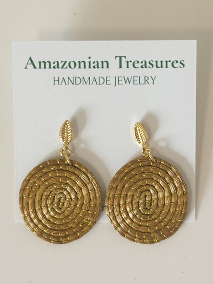 Golden Spiral golden grass spiral earrings handcrafted by quilombola artisans.