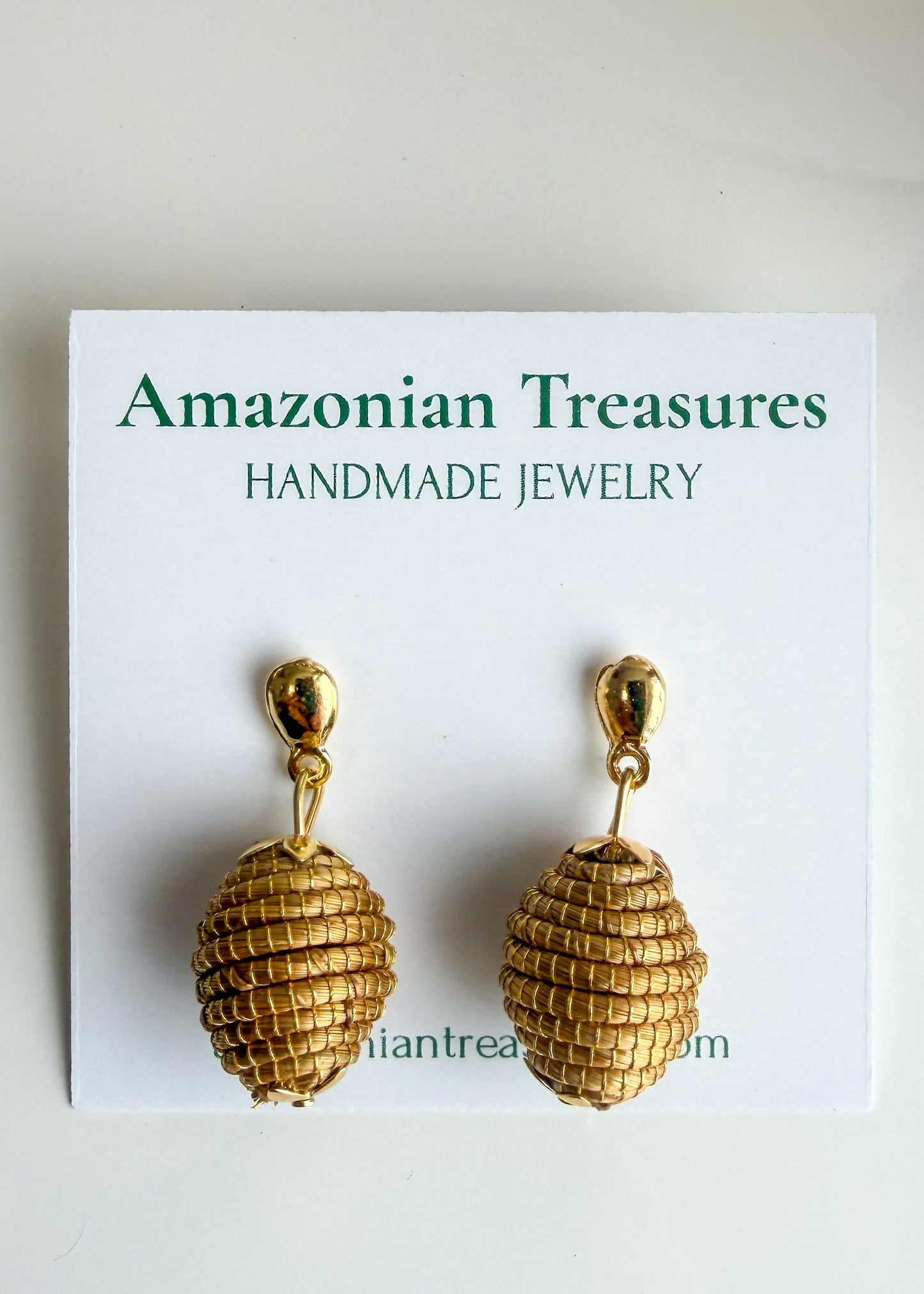 Golden grass earrings by quilombola artisans