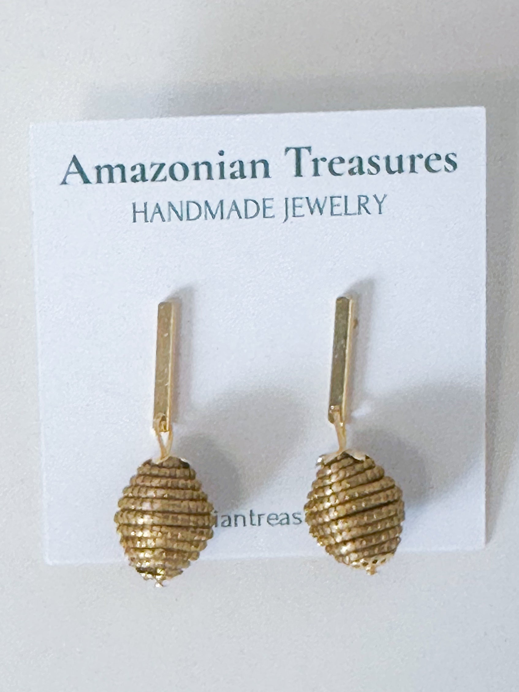 Golden grass earrings handcrafted in Brazil.