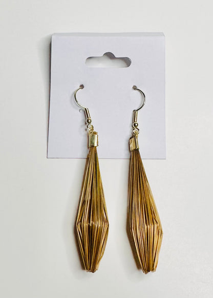 Golden grass earrings handmade in Brazil by quilombola community