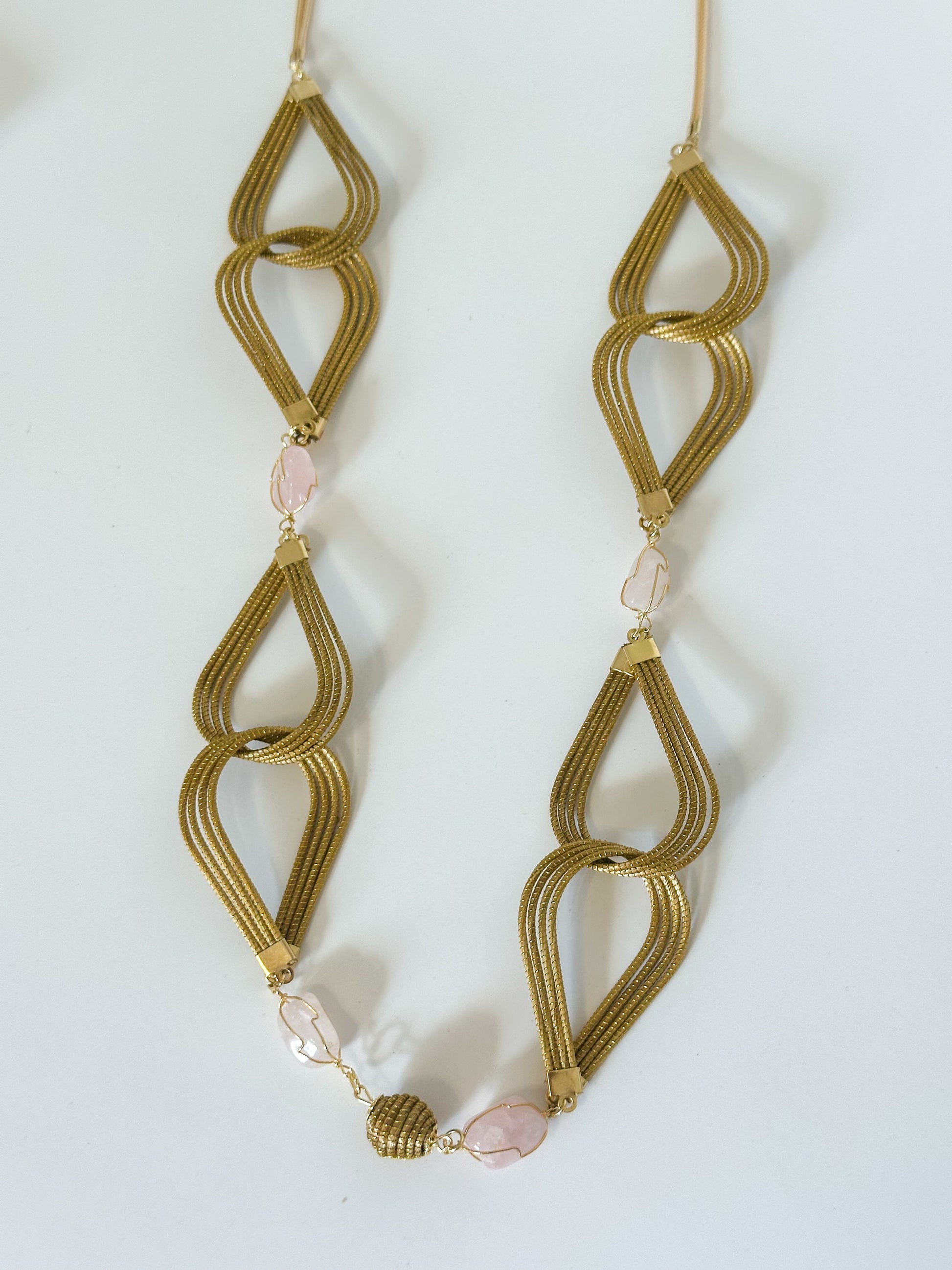 Golden grass necklace with rose quartz gemstone handcrafted in Brazil.