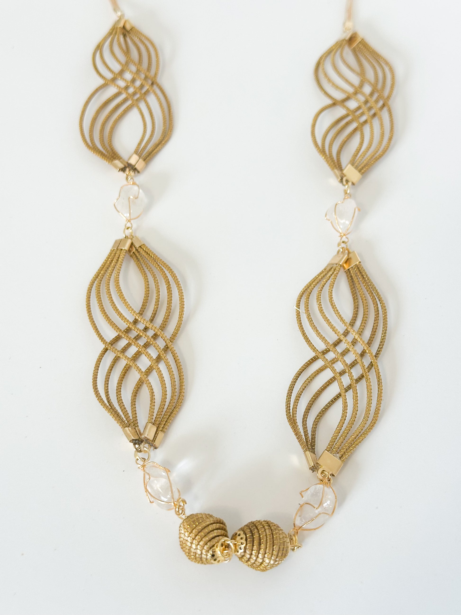 Golden grass necklace with white gemstone handcrafted using capim dourado.