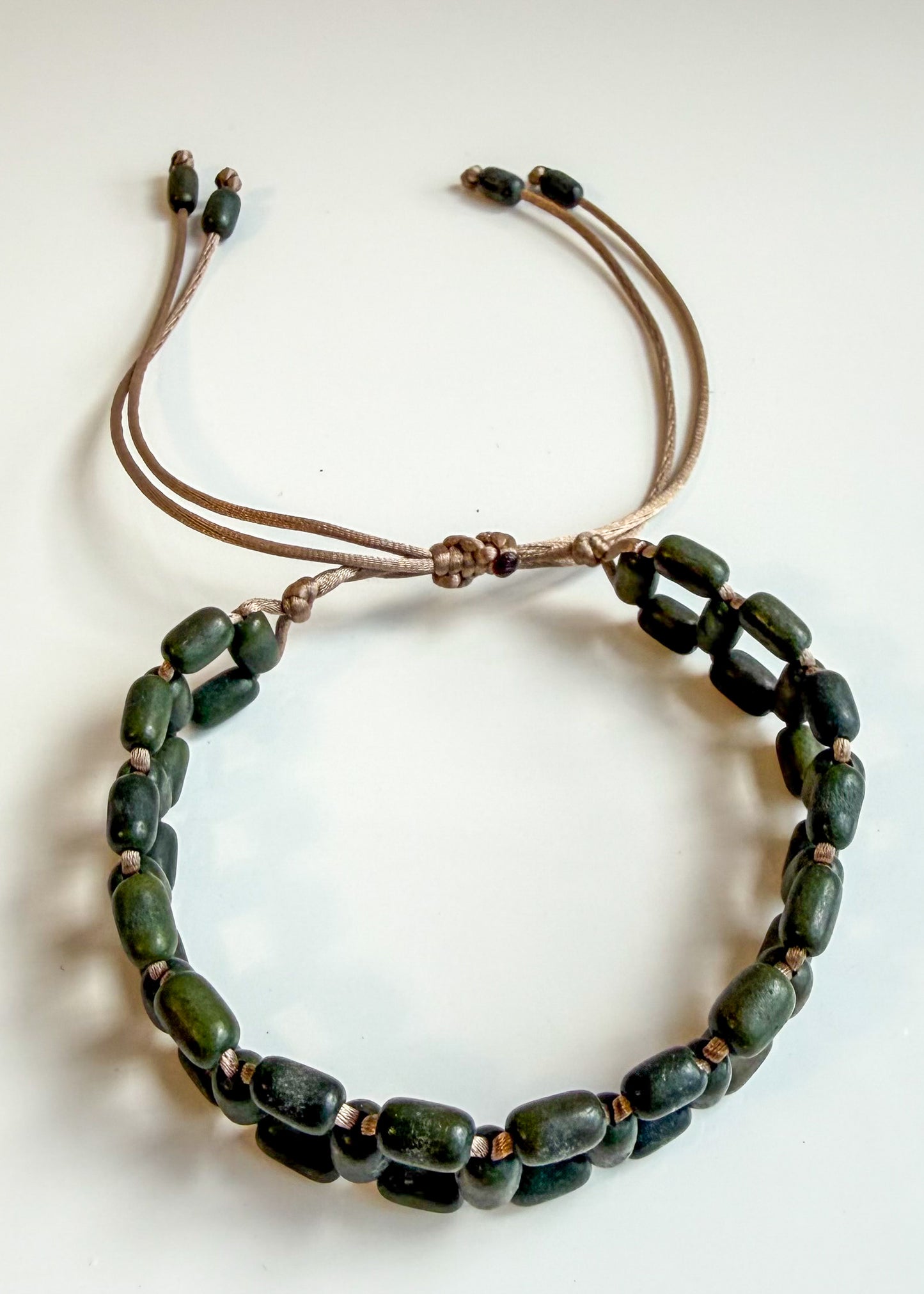 Green Açaí seed bracelet handcrafted by Brazilian artisans