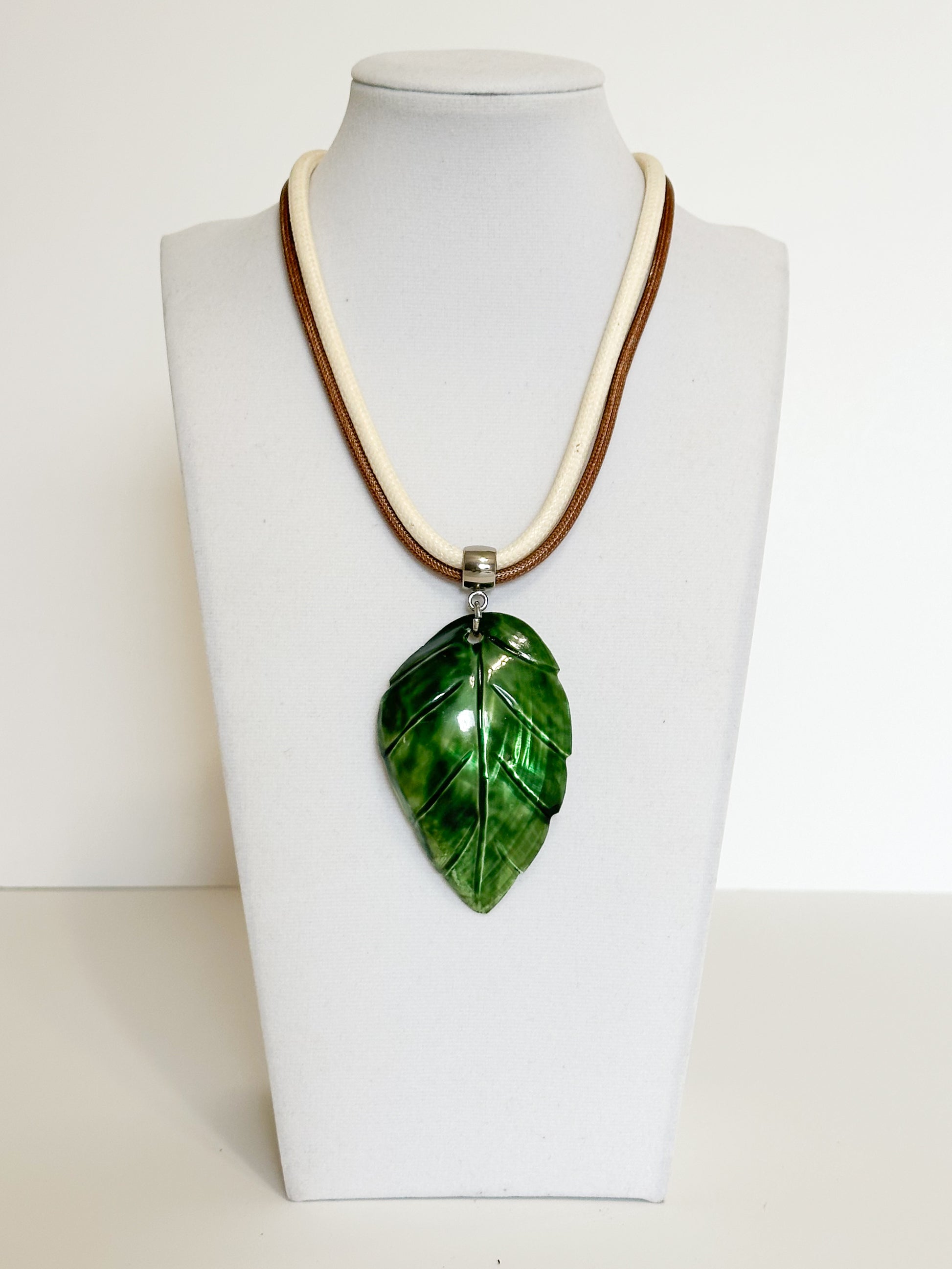 Green mother of pearl leaf pendant necklace inspired by the Amazon rainforest.