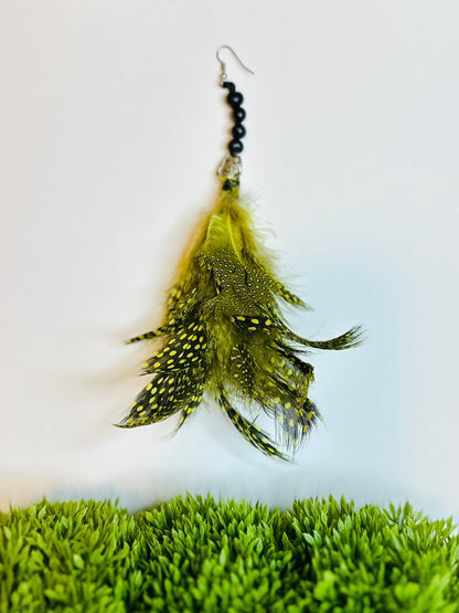 Handcrafted Amazon inspired feather earring close up