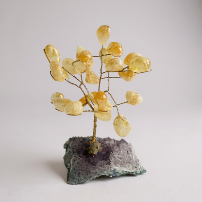 Handcrafted gemstone bonsai tree mounted on natural amethyst crystal base with wired branches and polished gemstone chips. Citrine Quartz Tree