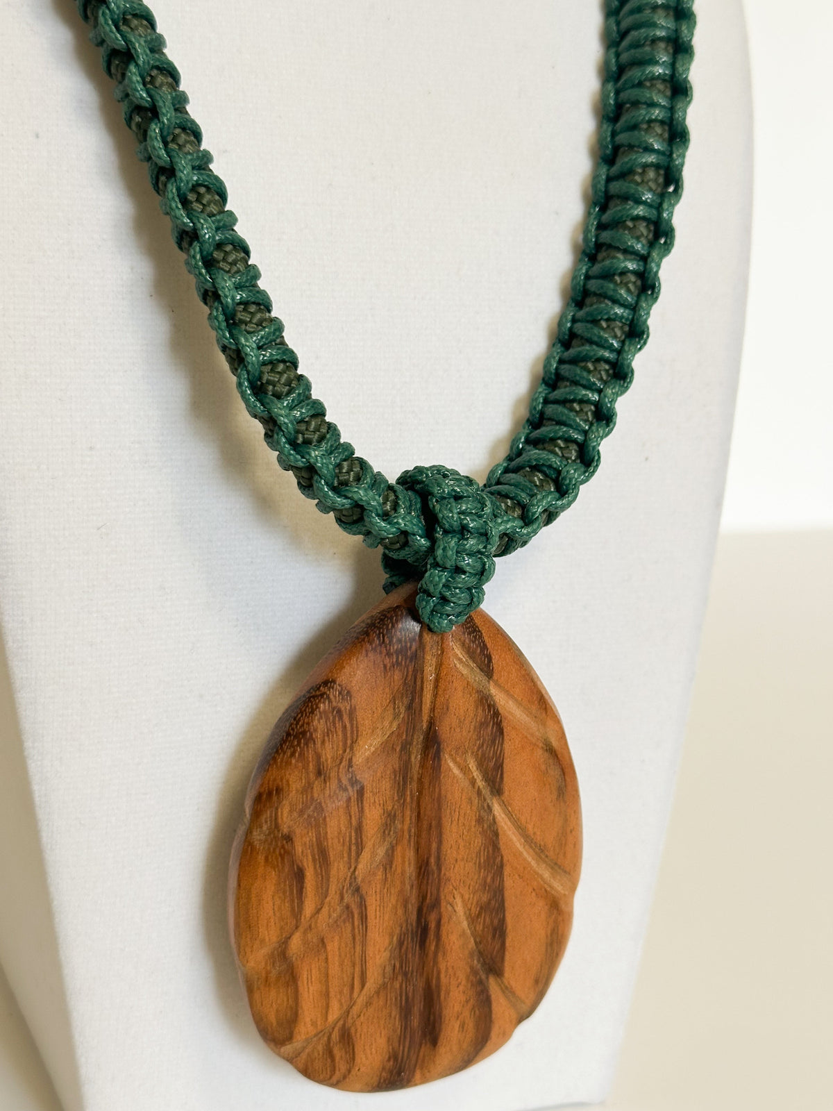 Handcrafted macramé cord necklace with natural Brazilian wood pendant.