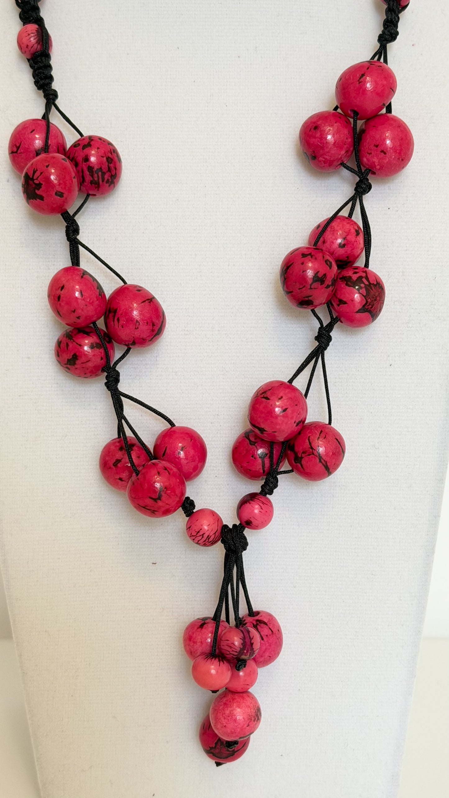 Handmade Brazilian necklace with pink Açaí seeds and dark cord