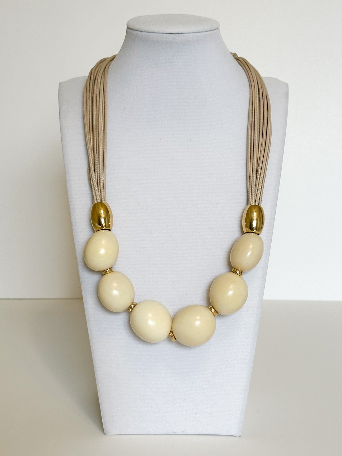Handmade jarina necklace crafted from vegetable ivory seeds by an Amazon artisan.