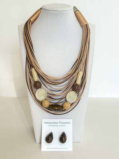 Layered cotton cord necklace with resin beads and matching resin earrings designed by a Brazilian jewelry studio. Brown