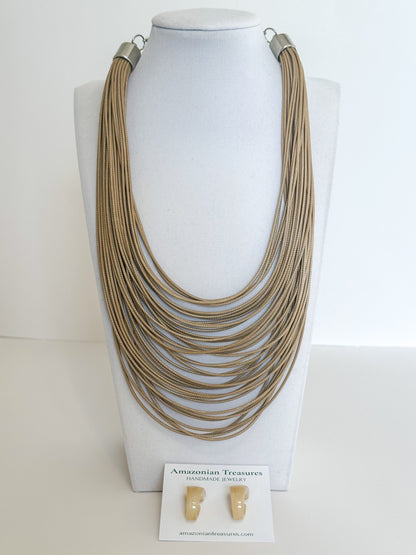 Layered cotton cord necklace with resin earrings designed by a Brazilian jewelry studio. Beige