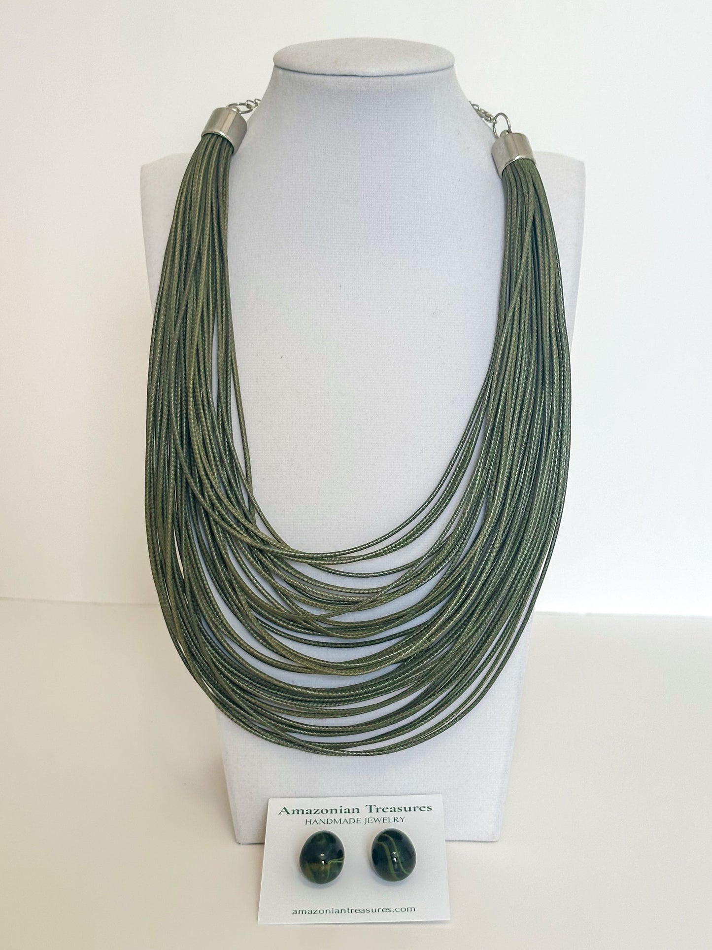 Layered cotton cord necklace with resin earrings designed by a Brazilian jewelry studio. Green moss