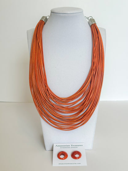 Layered cotton cord necklace with resin earrings designed by a Brazilian jewelry studio. orange