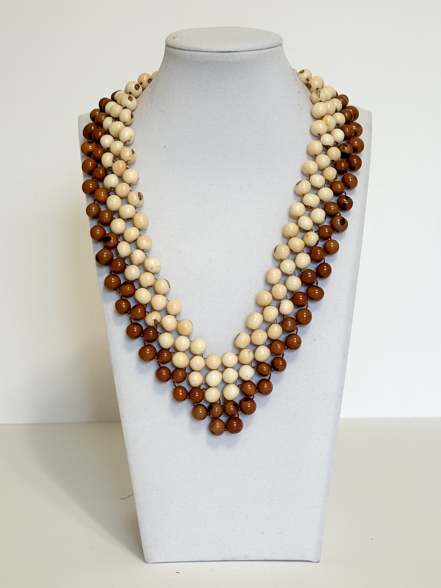 Layered dyed açaí seed statement necklace handcrafted in Brazil.