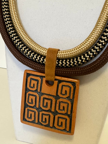 Layered rope necklace with ceramic pendant and suede accents handcrafted in Brazil.