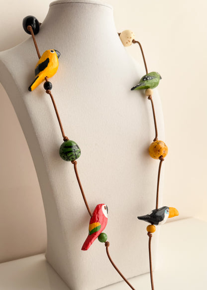 Long Brazilian necklace with hand-tinted Buriti and Paxiúba birds inspired by the Amazon