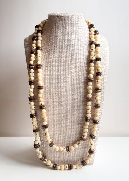 Long layered Açaí seed and coconut shell necklace handcrafted by Brazilian artisans