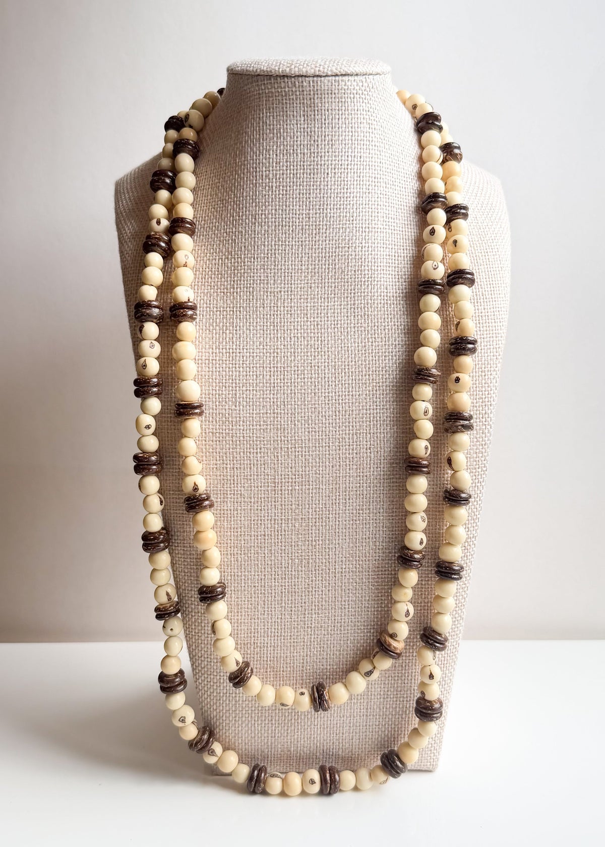 Long layered Açaí seed and coconut shell necklace handcrafted by Brazilian artisans