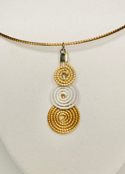 Layered golden grass pendant with white tinted detail